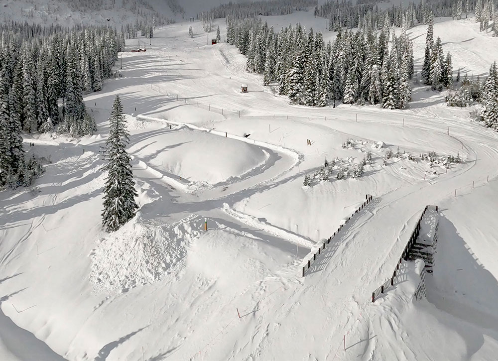 Rendering of a modern mountain clubhouse at Schweitzer with families gathered on the snowy terrace